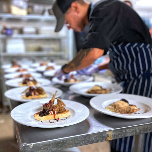 Plating dishes for an event.
